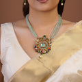 Samraagni aqua green bead multicolour kundan pendant necklace with pale centre stone, jewel-tone accents, pearl drop and matching earrings