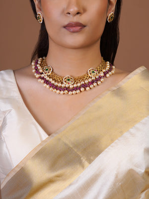 Samraagni round kundan stud earring close-up with green centre, ruby accents and pearl border