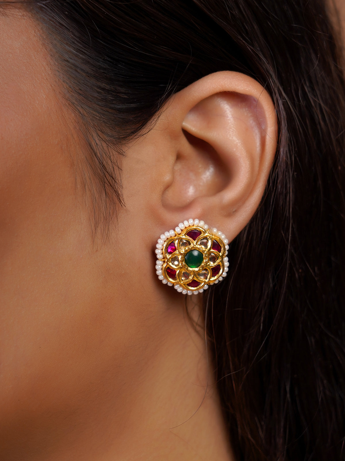 Samragni ruby pearl layered kundan choker close-up showing antique gold links, floral medallions and multiple pearl strands