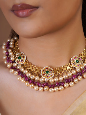Samragni layered pearl and ruby bead kundan choker necklace set with green floral medallions and matching round stud earrings