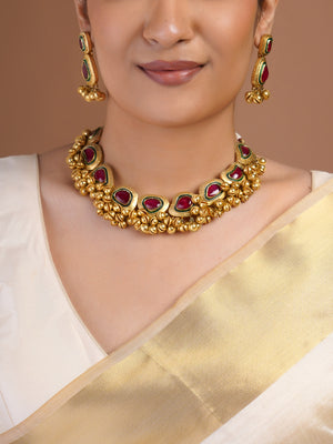 Samragni antique gold ruby green statement earring close-up with rectangular and teardrop stones and clustered gold bead fringe