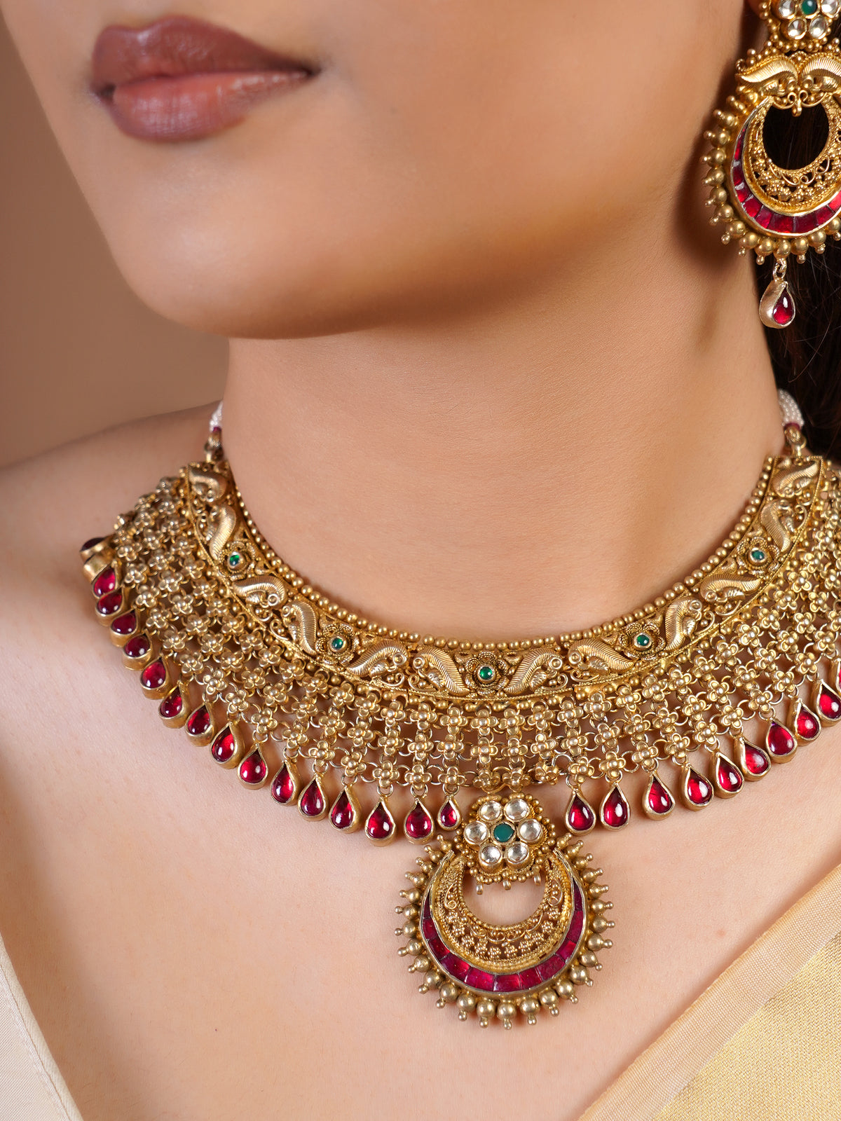 Samragni ruby antique gold chain fringe choker necklace set with teardrop border, central crescent pendant and matching statement earrings