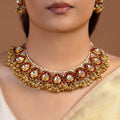 Samragni ruby kundan antique gold choker necklace set with teardrop motifs, white stones, pearl edging and matching earrings