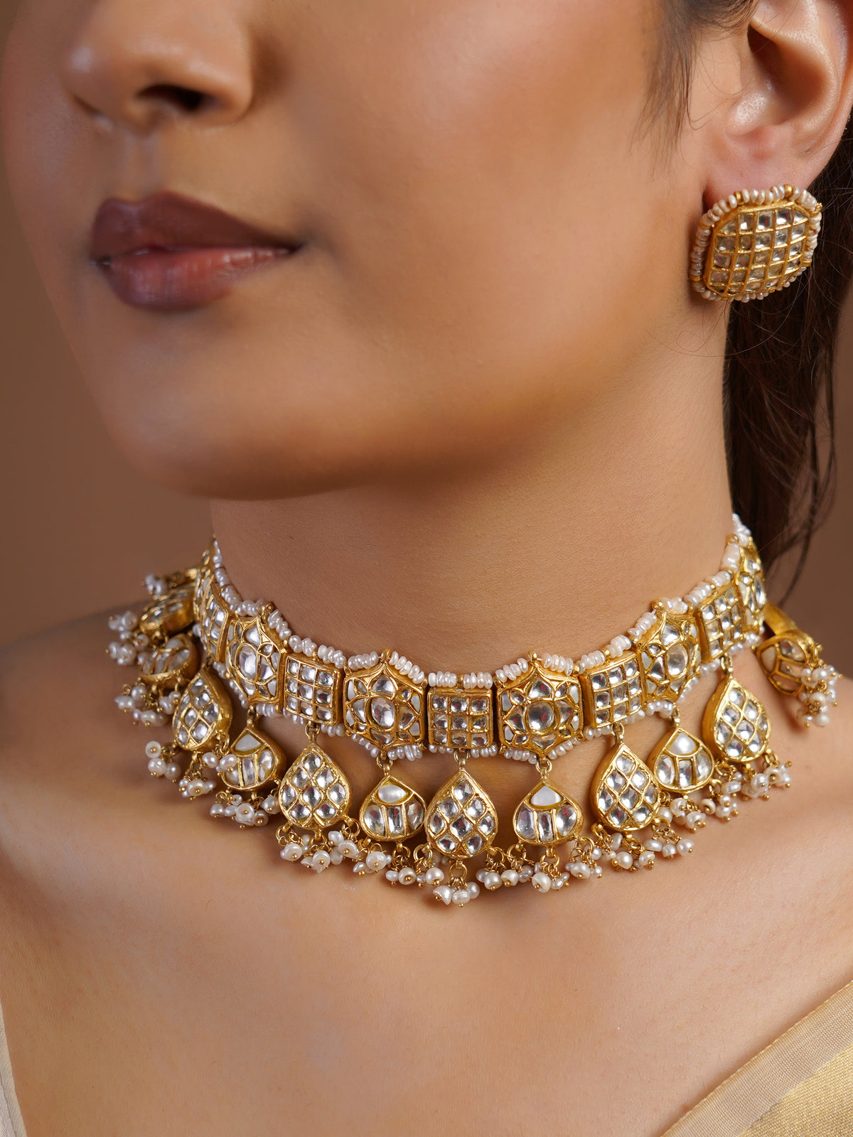 Samraagni white kundan rectangular stud earring close-up with grid-set stones and pearl border