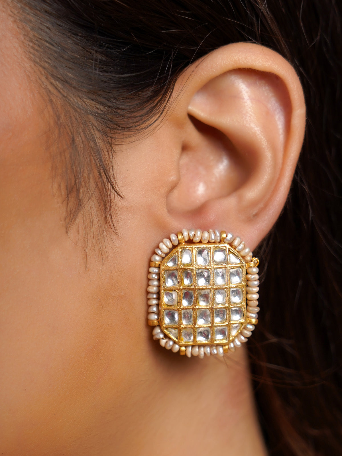 Samraagni white kundan pearl drop bridal choker shown on model with matching rectangular stud earrings