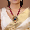 Samragni ruby bead blue kundan statement pendant necklace set with white stone halo, pearl drops and matching earrings