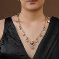SITA RATNA ruby green charm moissanite necklace set styled on model in black saree