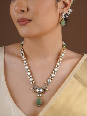 SITA RATNA matching green carved teardrop moissanite earring close-up