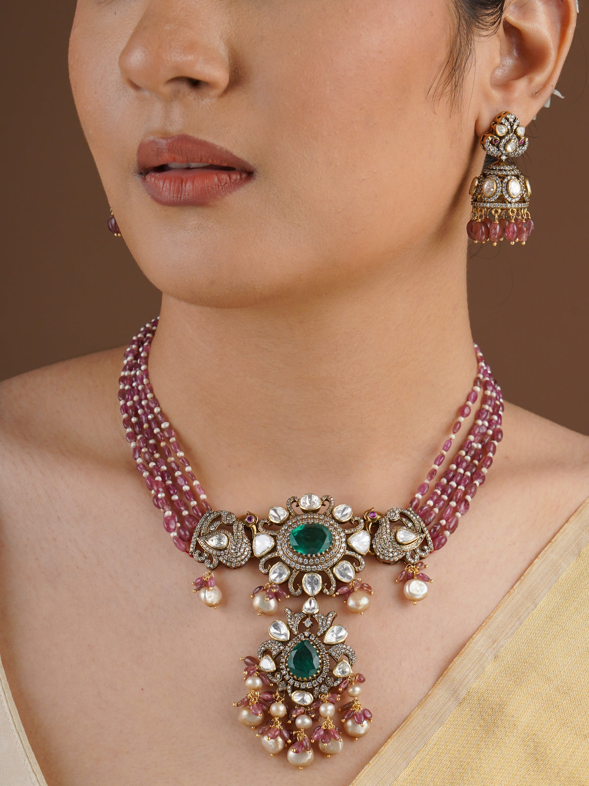 SITA RATNA matching moissanite jhumka earring with pink bead drops close-up