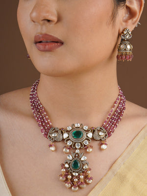 SITA RATNA matching moissanite jhumka earring with pink bead drops close-up