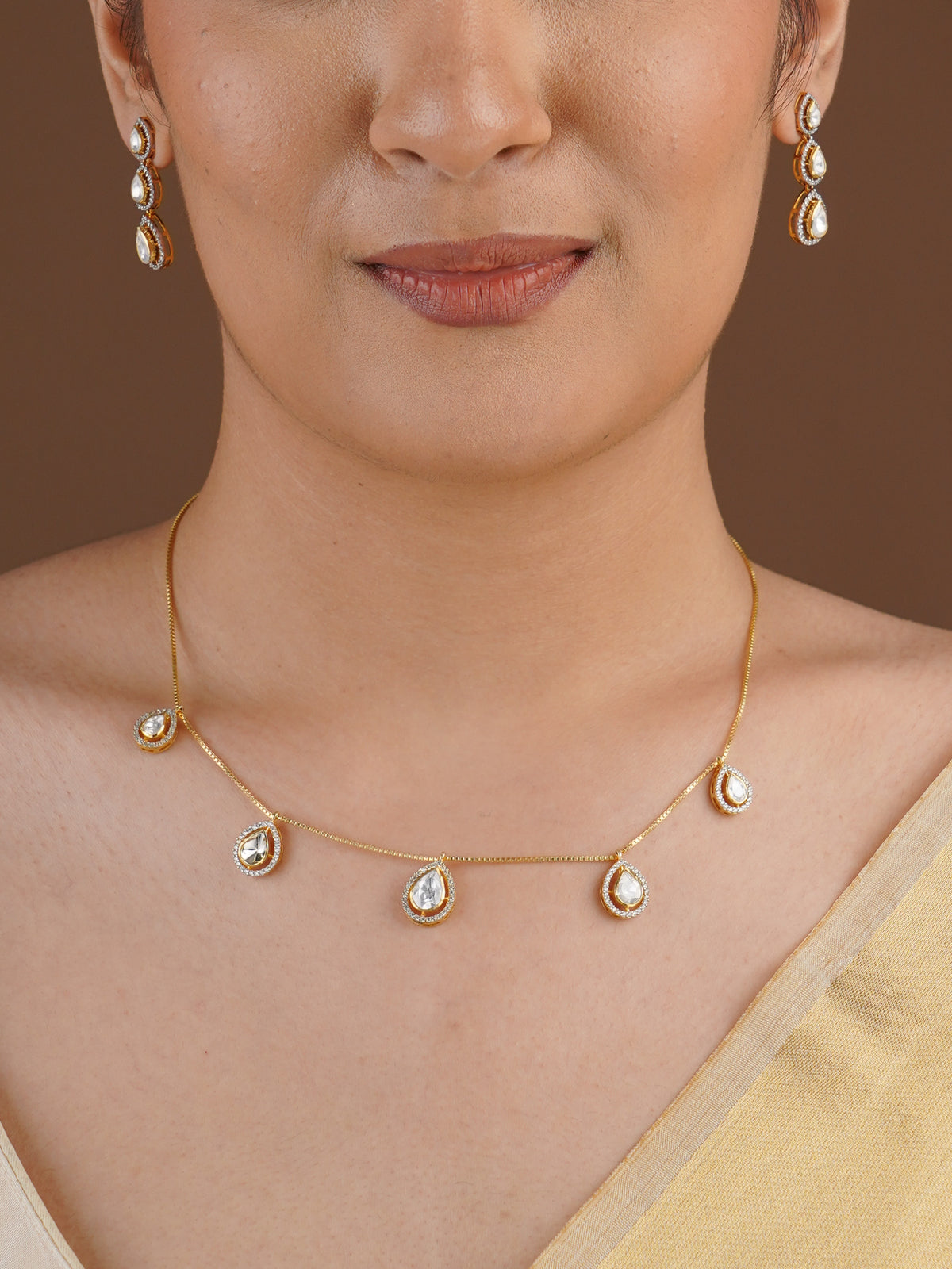 SITA RATNA three teardrop moissanite drop earring close-up