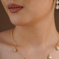 SITA RATNA five teardrop moissanite delicate necklace set styled on model
