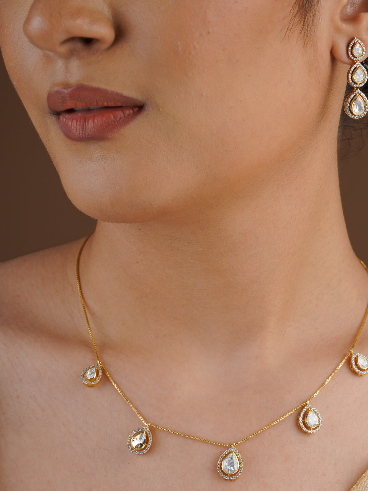 SITA RATNA five teardrop moissanite delicate necklace set styled on model