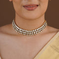 SITA RATNA three-row white moissanite antique gold choker close-up on model