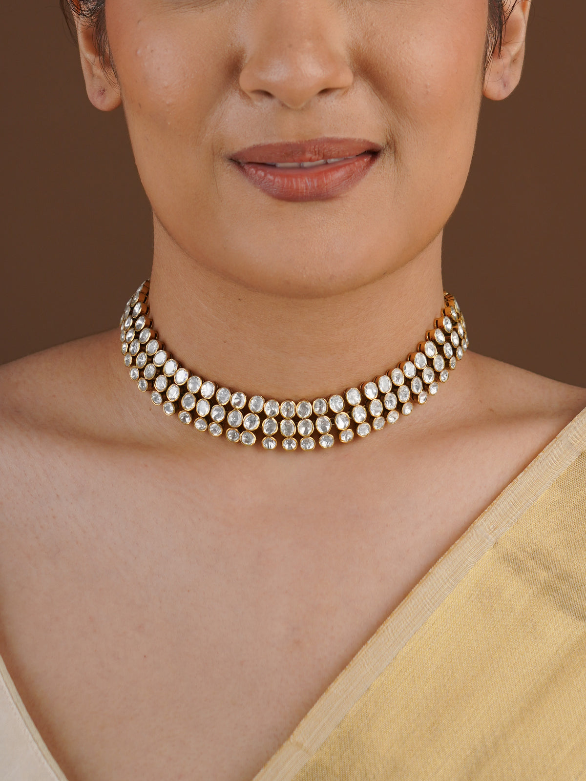 SITA RATNA three-row white moissanite antique gold choker close-up on model