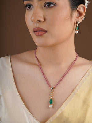 SITA RATNA pink bead necklace with green teardrop moissanite pendant close-up