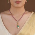 SITA RATNA pink bead green drop moissanite pendant set styled on model