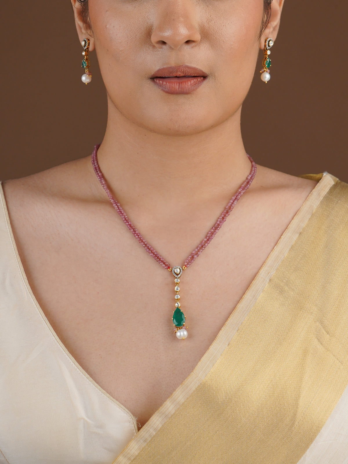SITA RATNA pink bead green drop moissanite pendant set styled on model