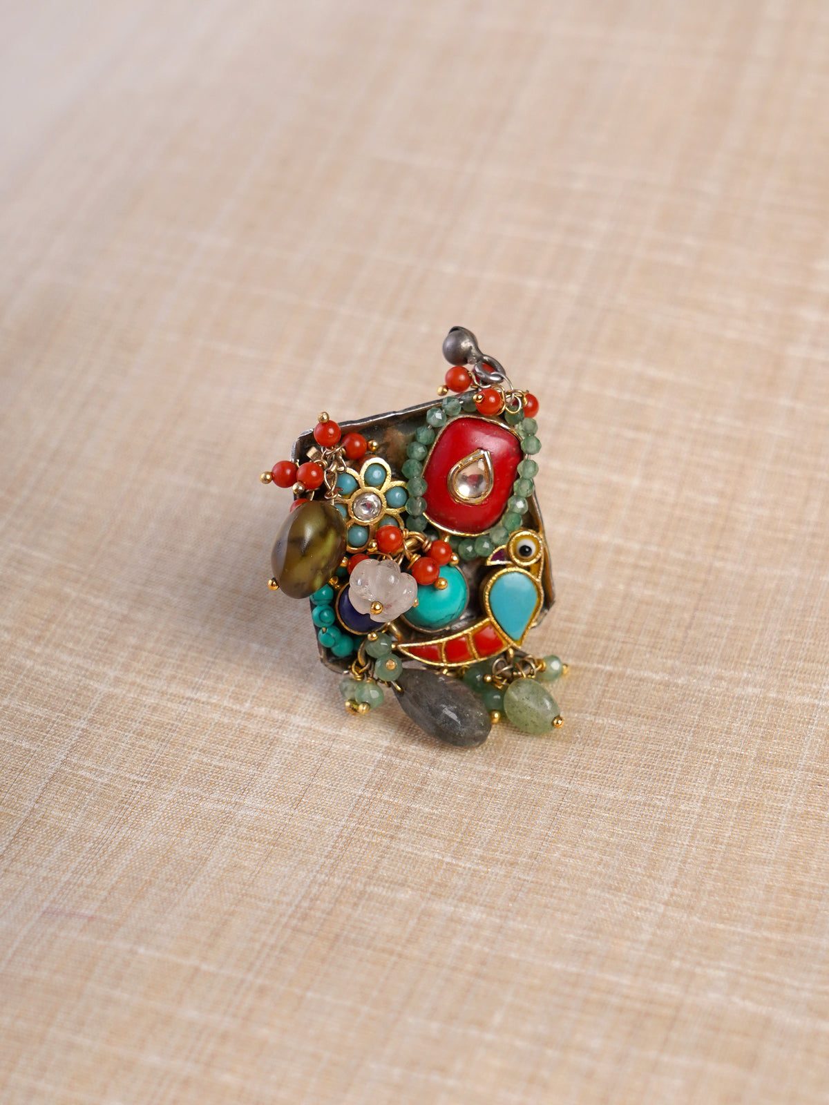 Sitamahor navrangi multicolour artisan fusion statement ring shown on hand with turquoise, coral and green stone accents