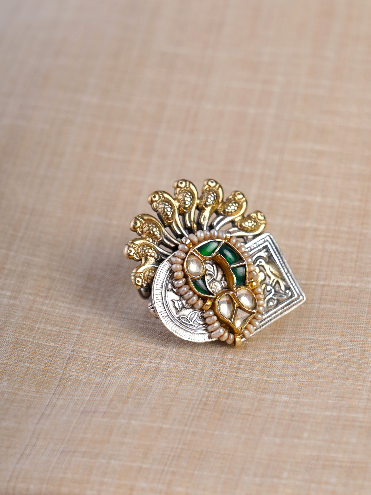 Sitamahor peacock fan green kundan dual-tone fusion statement ring shown on hand with pearl edging and mixed silver-gold design