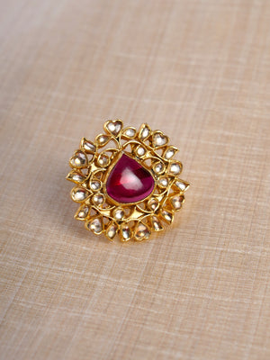 Samraagni ruby teardrop kundan jadau floral statement ring shown on hand with white kundan-style halo and antique gold setting