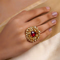 Samragni ruby teardrop kundan jadau floral statement ring with deep red centre stone, white kundan-style halo and antique gold finish