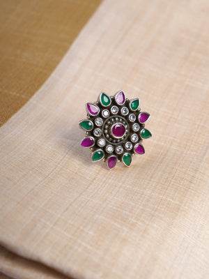 Samragni ruby emerald oxidized kundan floral statement ring shown on hand with green, pink and white stone detailing
