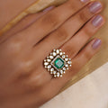 Samragni emerald square kundan polki statement ring with vivid green centre stone, white teardrop halo and antique gold finish