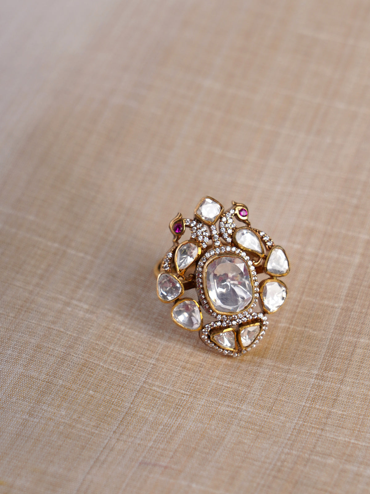 Sitaratna white moissanite artisan cluster statement ring shown on hand with large clear centre stone and mixed-cut white accents
