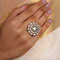 Sitaratna white moissanite floral halo statement ring with round clear centre and layered pear-shaped sparkling white stones