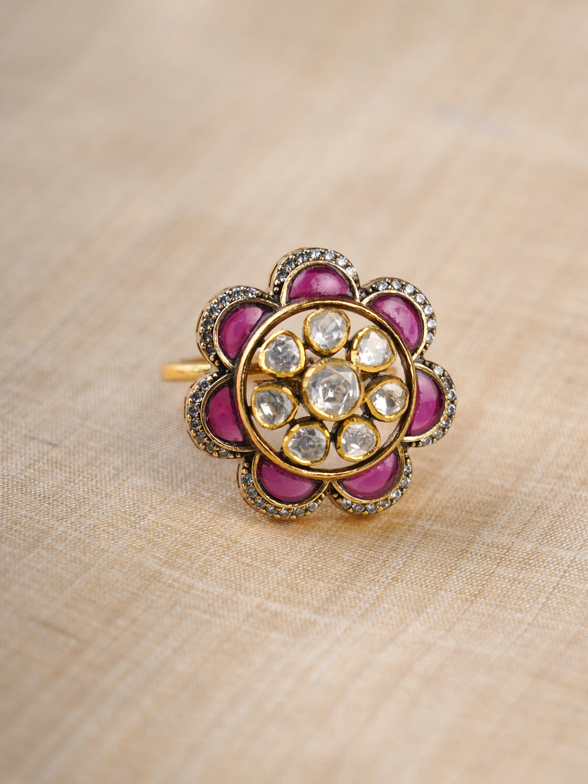 Sitaratna ruby and white moissanite floral ring styled on hand