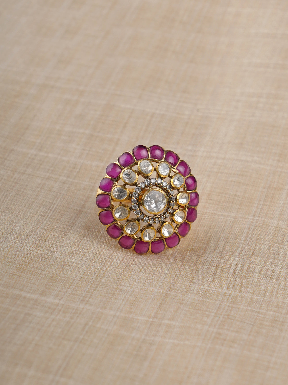 Sitaratna ruby and white moissanite halo ring styled on hand close-up