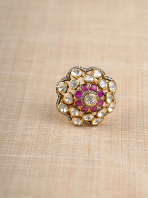 Sitaratna ruby and white floral halo moissanite ring styled on hand