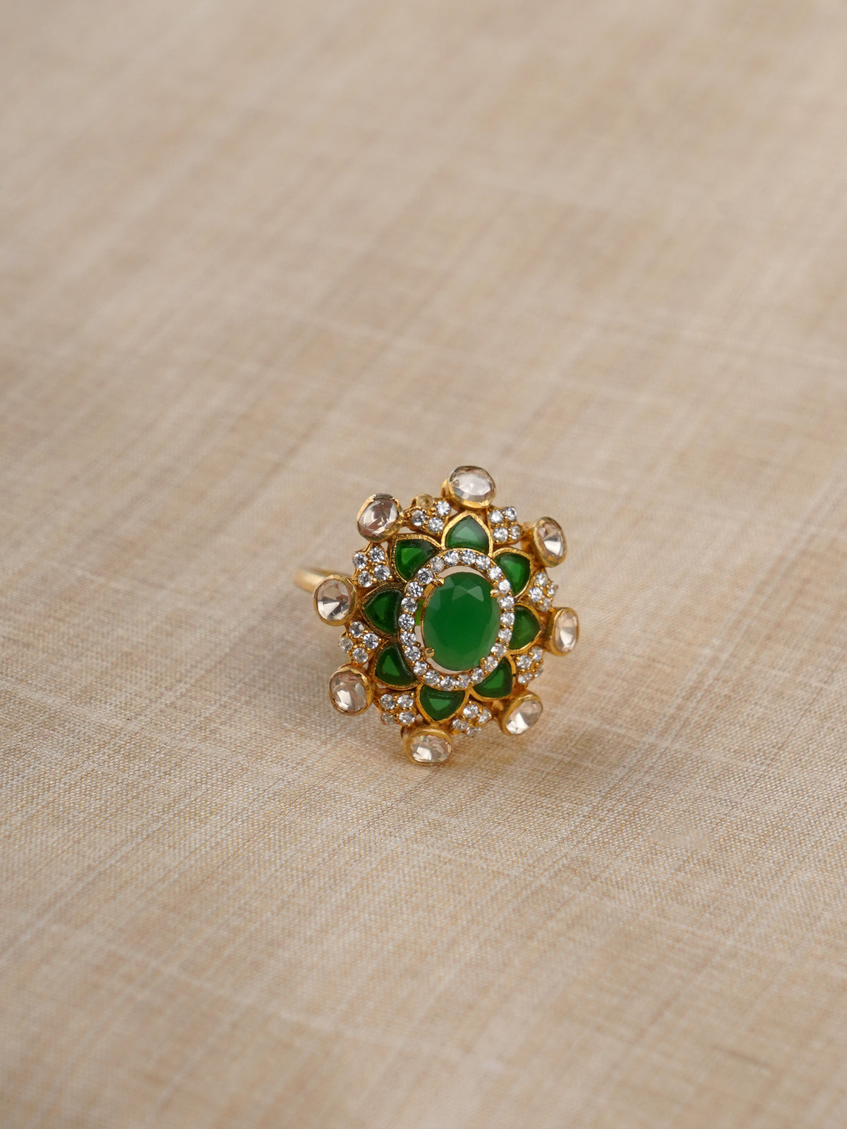 Sitaratna green and white radial moissanite halo ring styled on hand