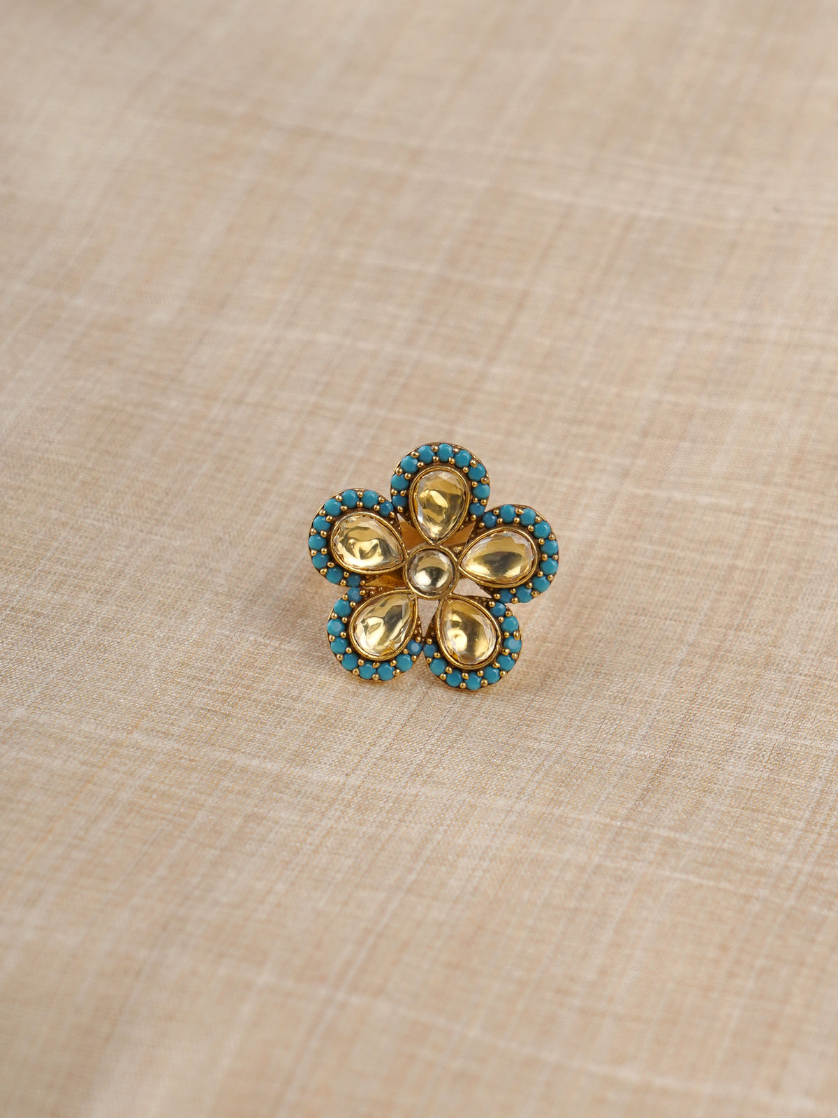Sitaratna turquoise floral gold-plated moissanite ring styled on hand