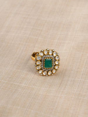 Sitaratna emerald green halo ring close-up with white moissanite-style stones