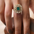 Sitaratna emerald green halo moissanite statement ring styled on hand