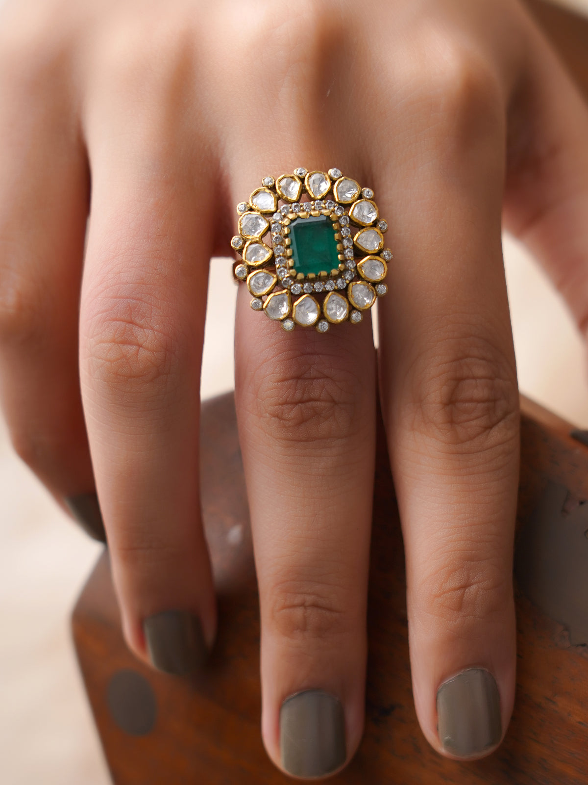 Sitaratna emerald green halo moissanite statement ring styled on hand