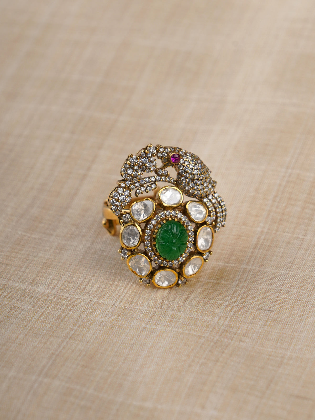Sitaratna ornate green and white peacock moissanite statement ring close-up