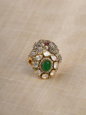 Sitaratna ornate green and white peacock moissanite statement ring close-up