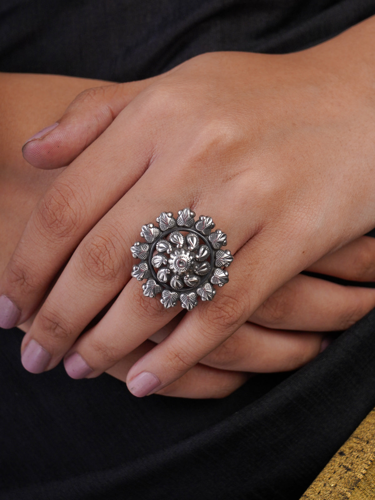Sitavan oxidised silver heritage ring with round layered floral medallion and sculpted petal detailing