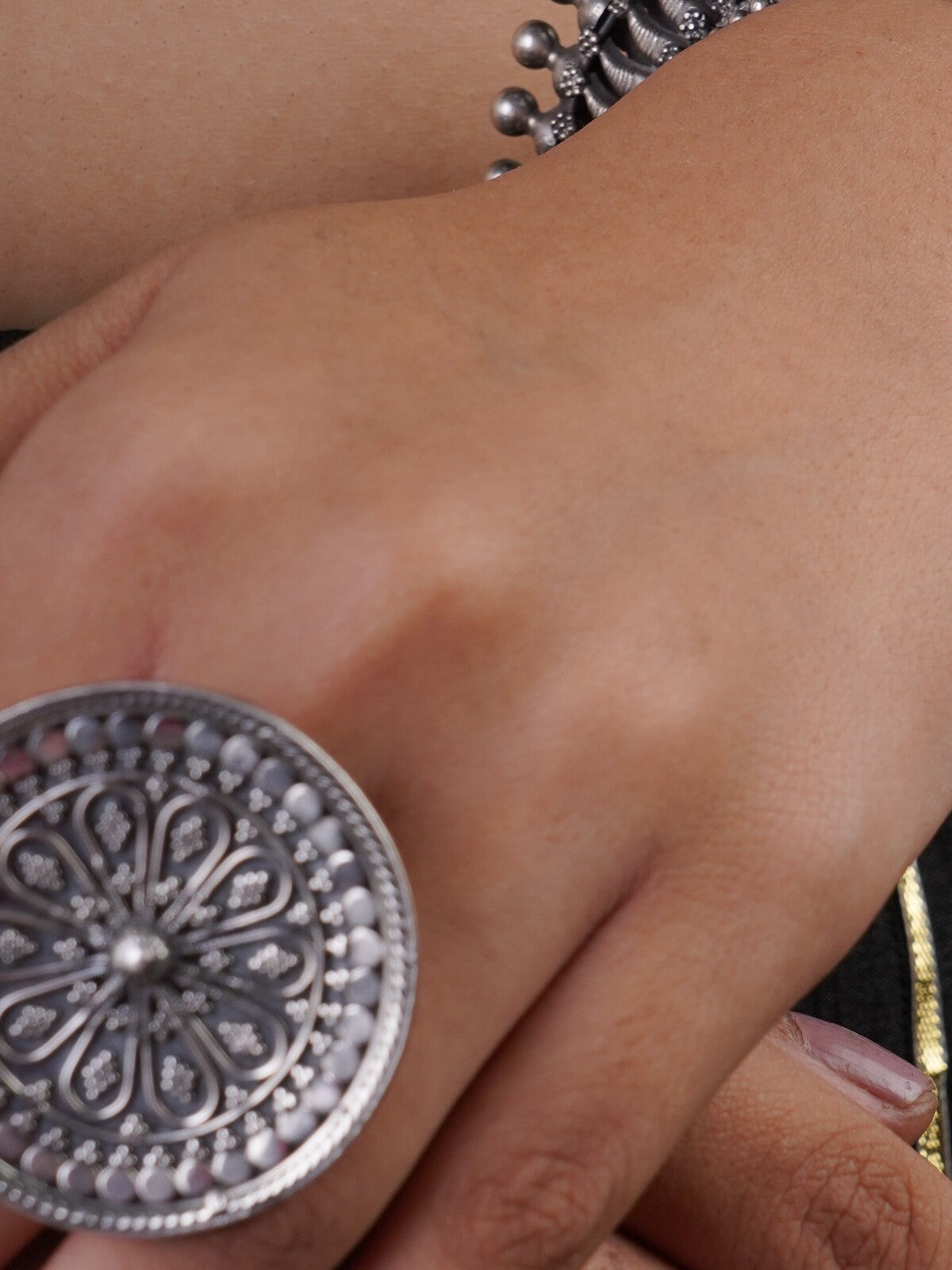 Sitavan large round oxidised silver statement ring with engraved floral chakra pattern and textured beaded border
