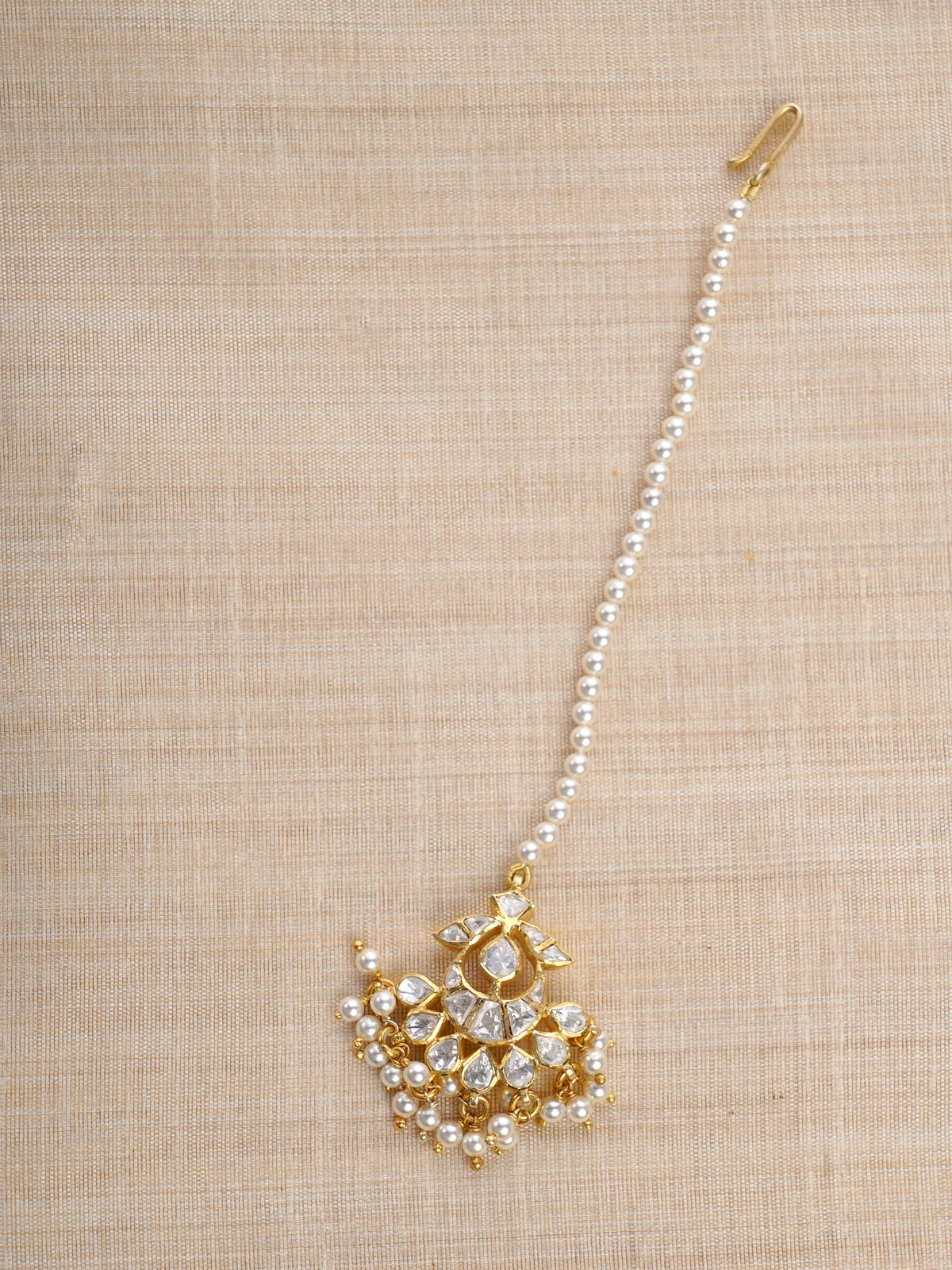 Sitaratna pearl fringe moissanite maang tikka close-up styled on forehead